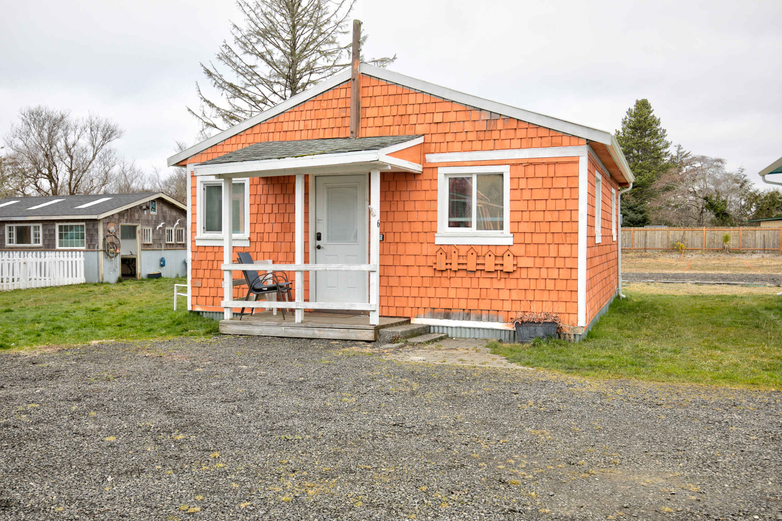 Cottage 6 exterior — warm coral shingle cottage