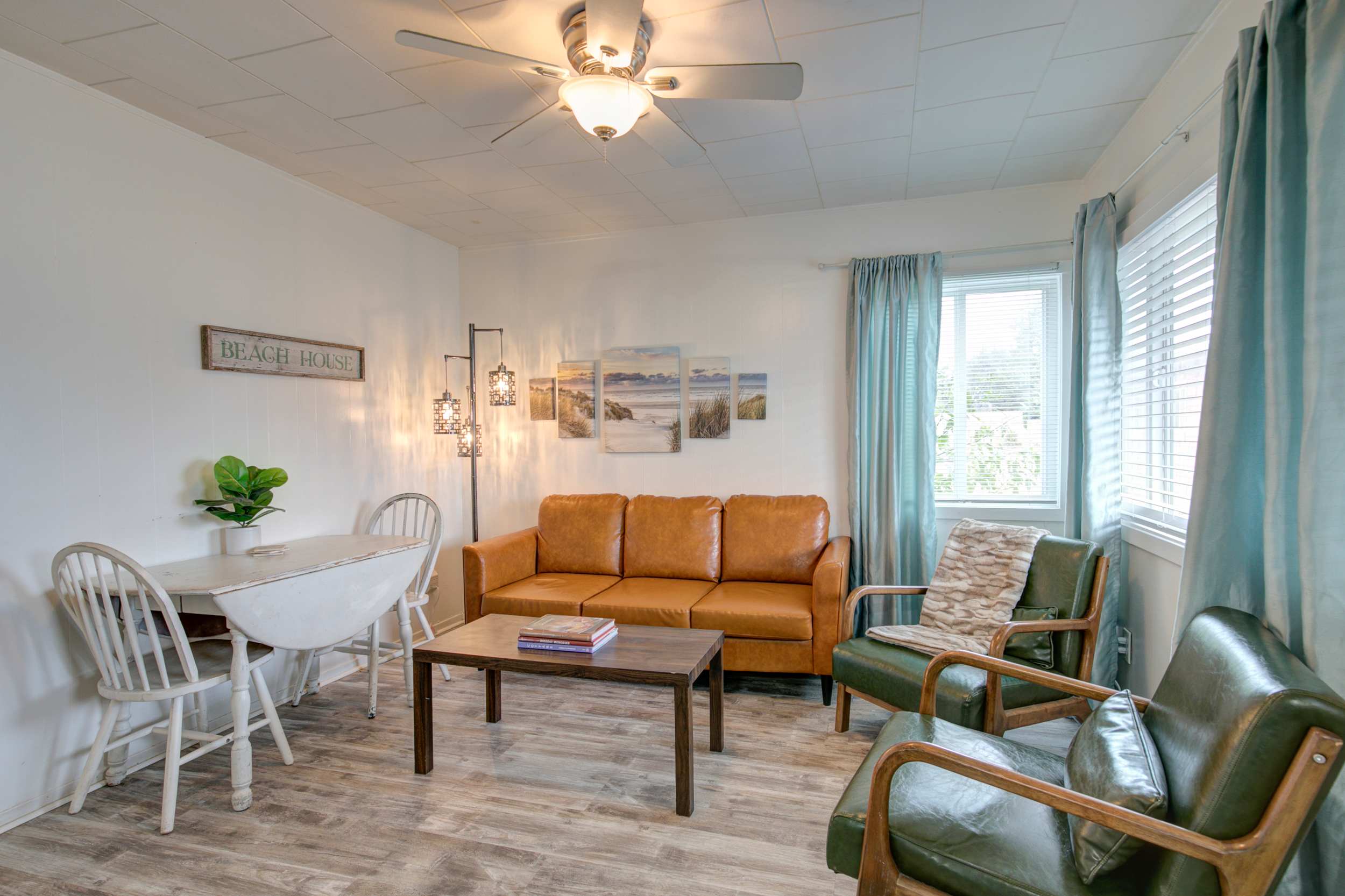 Cottage 7 living area — beach house decor with coastal artwork