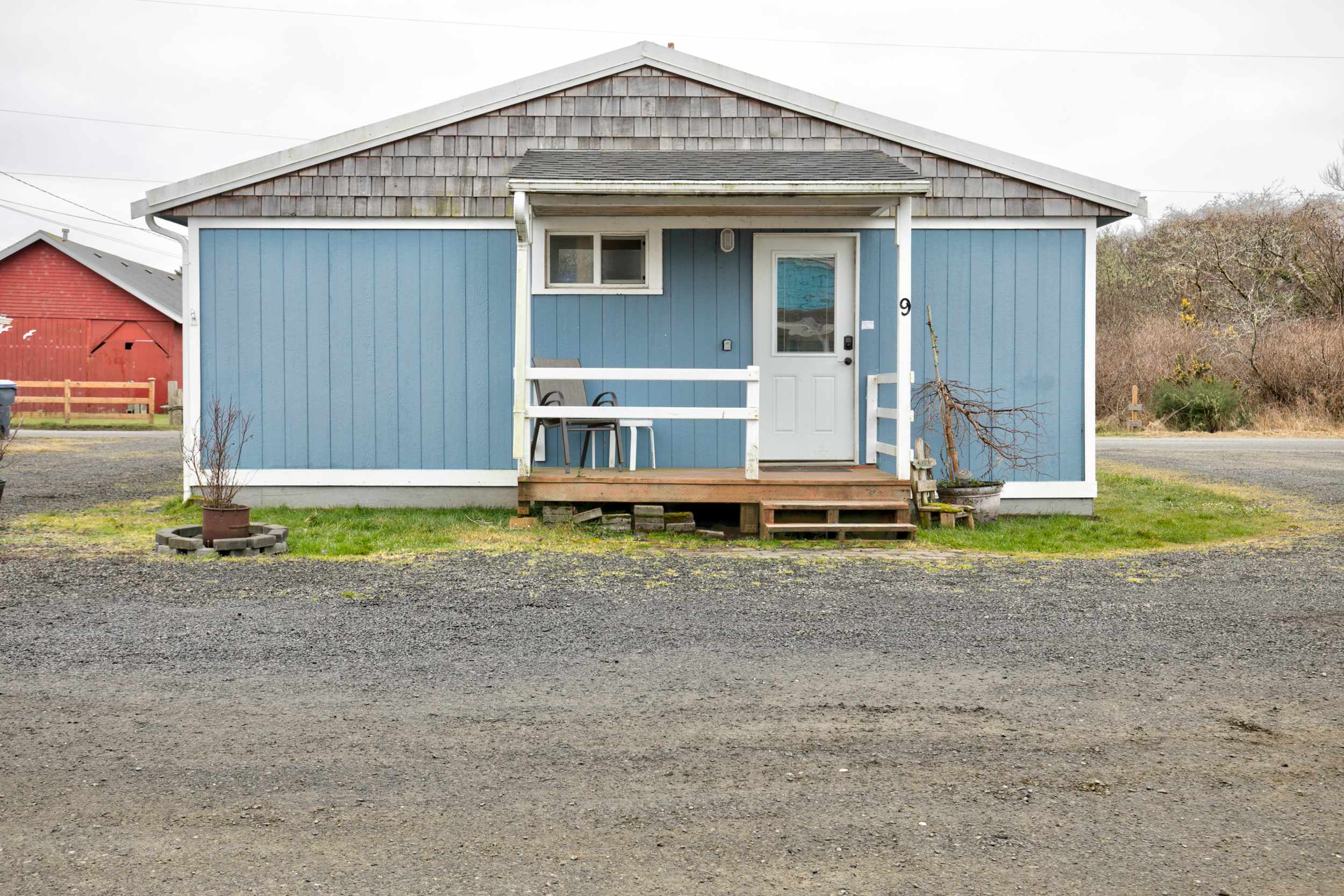 Cottage 9 exterior — soft blue cottage with porch
